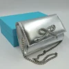 POCHETTE ARGENTO CON FIOCCO STRASS