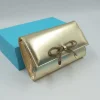POCHETTE PLATINO CON FIOCCO STRASS
