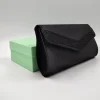 POCHETTE TESSUTO NERO DETTAGLIO LUX